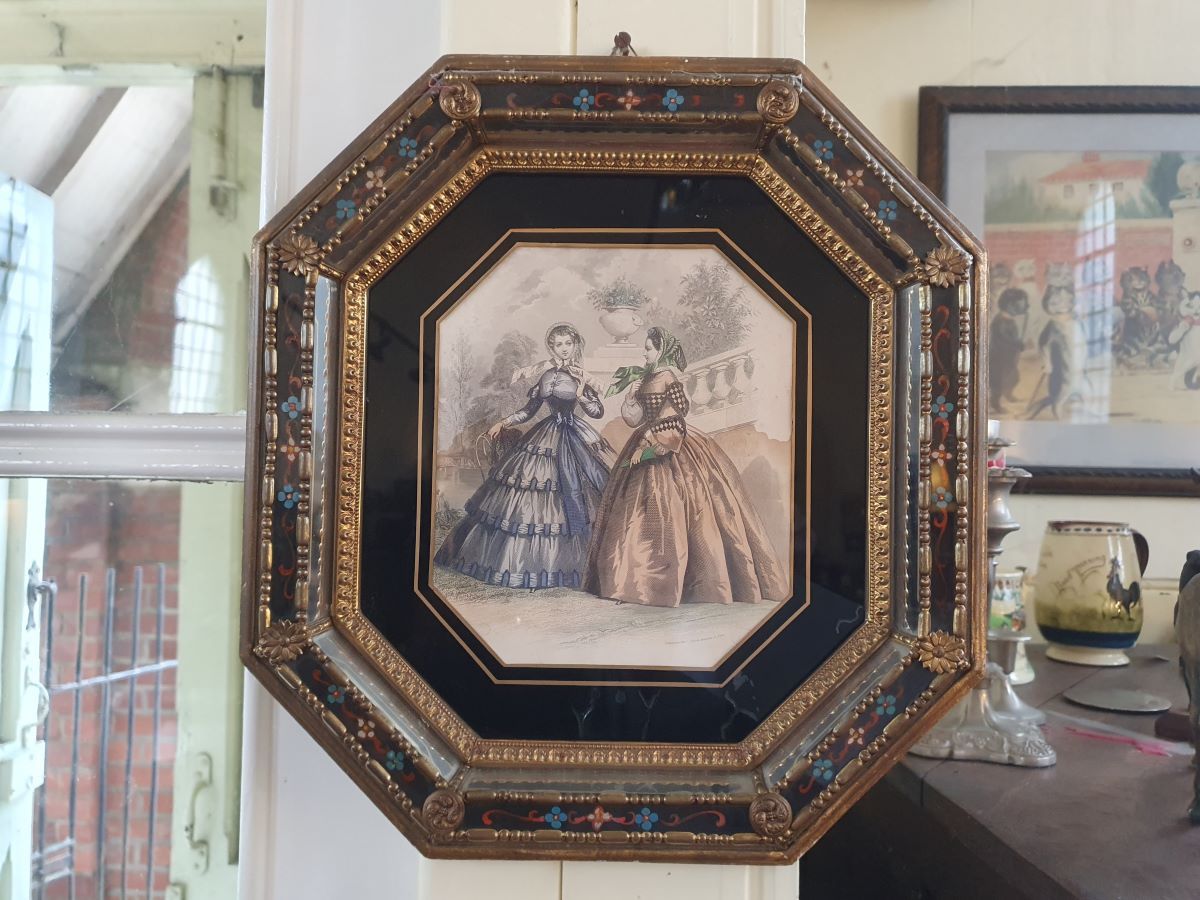 An embossed Brass And Verre Eglomise Mirrored Frame